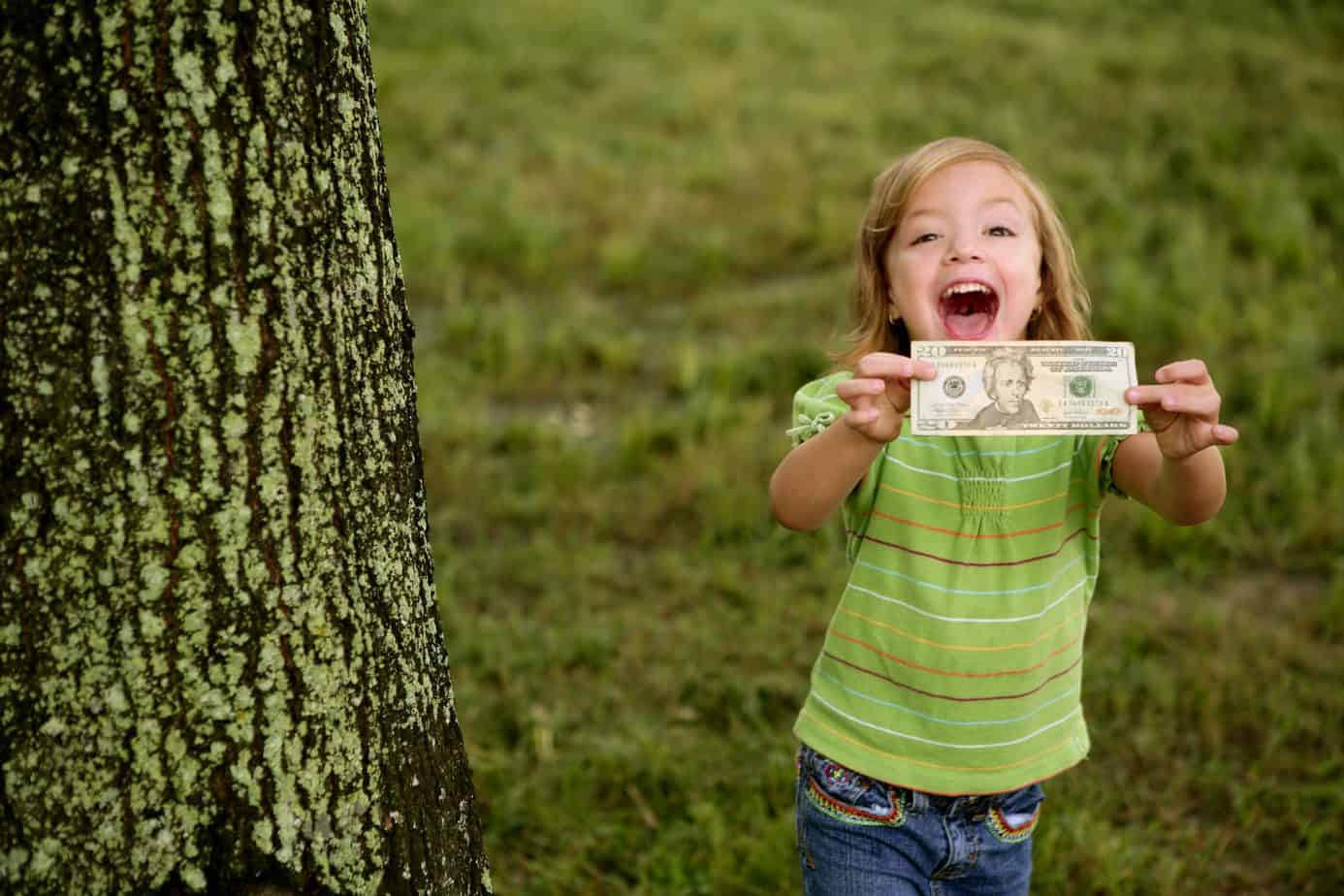 little girl with money in her hand