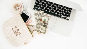 laptop computor wallet and money