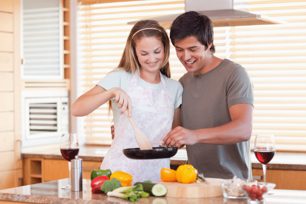 couple happy cooking together at home