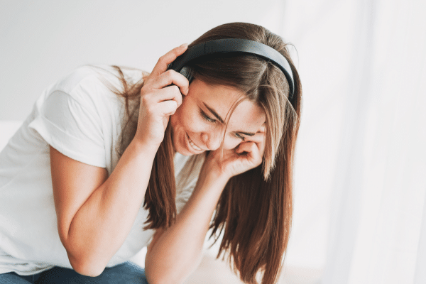 woman with headphones smiling