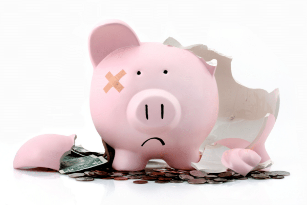 broken piggy bank with sad face