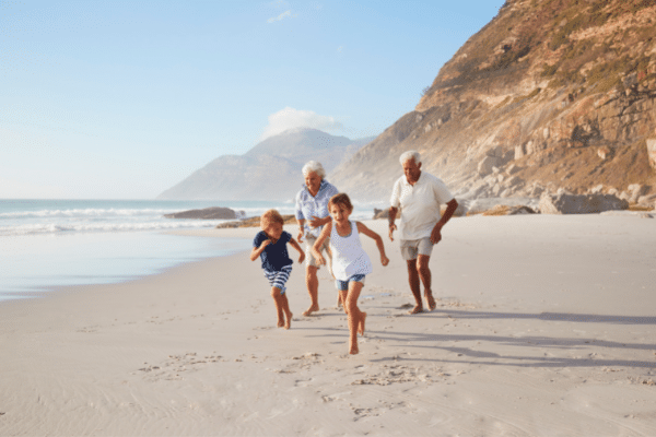 retired couple playing with grandchildren