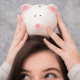 woman piggy bank on head