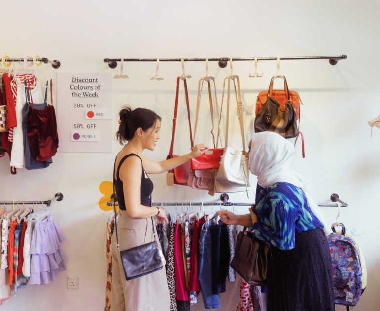 woman buying at thrift store