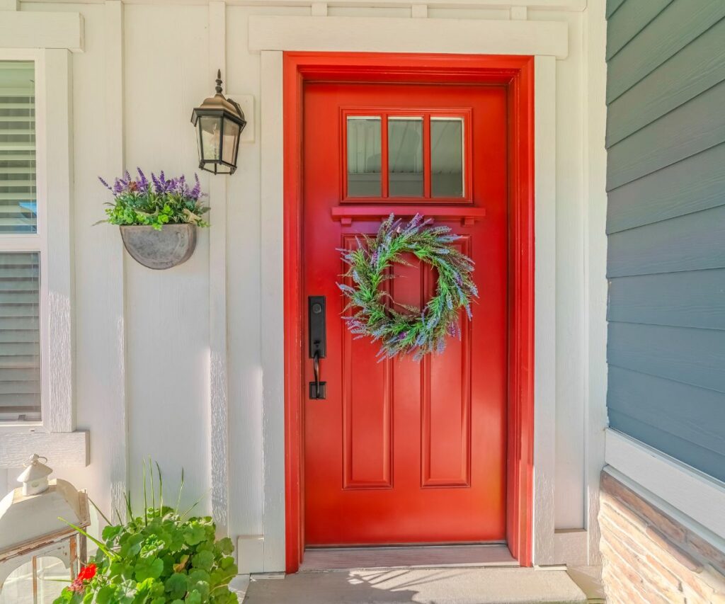 budget decor front porch with red door lavendar wreath