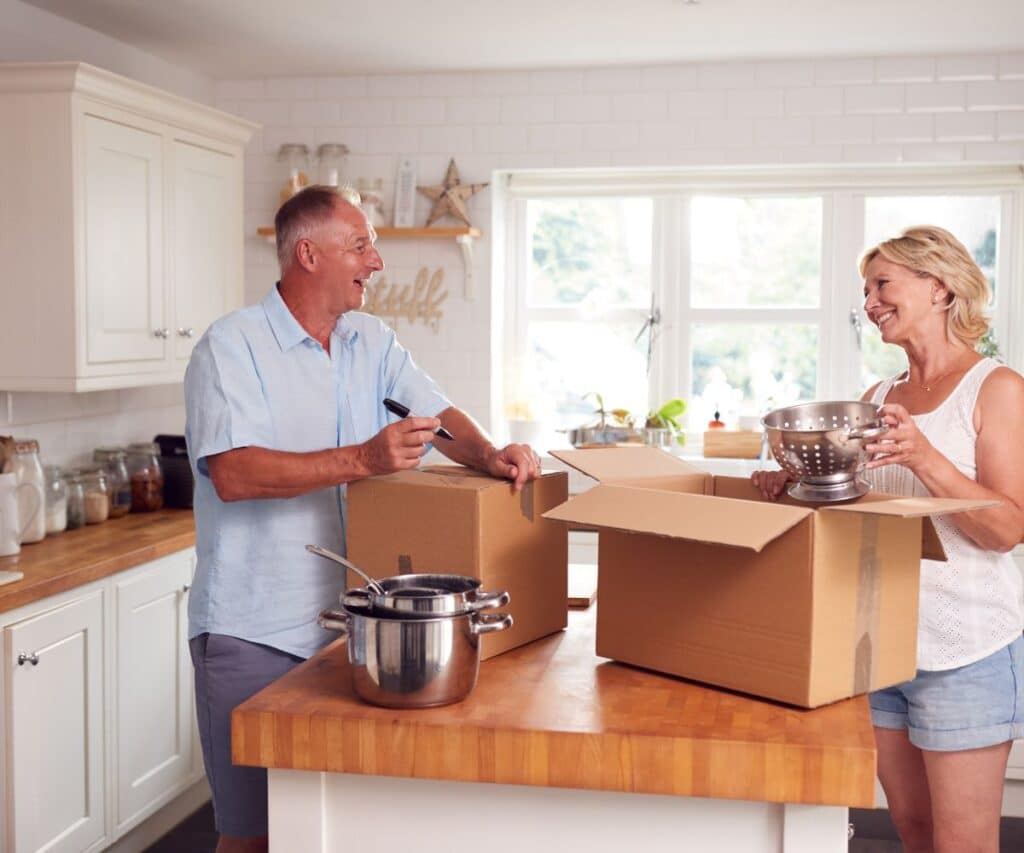 couple packing up their kitchen to downsize