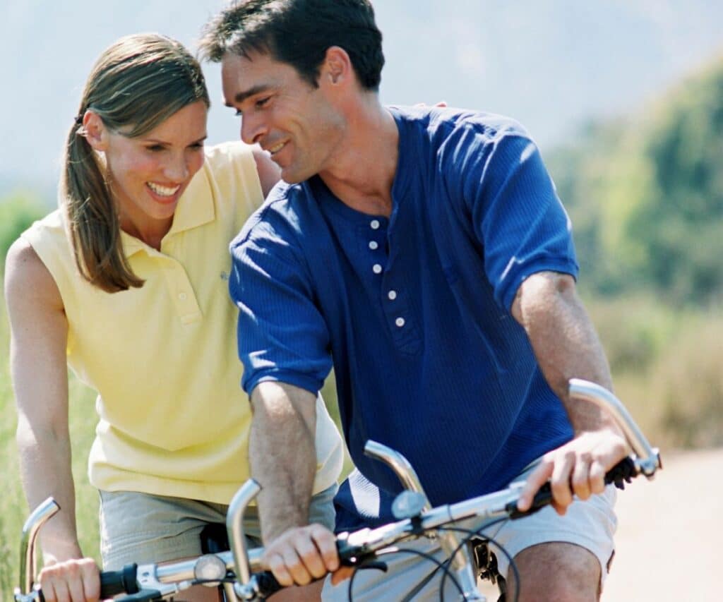 young couple on a bike riding date
