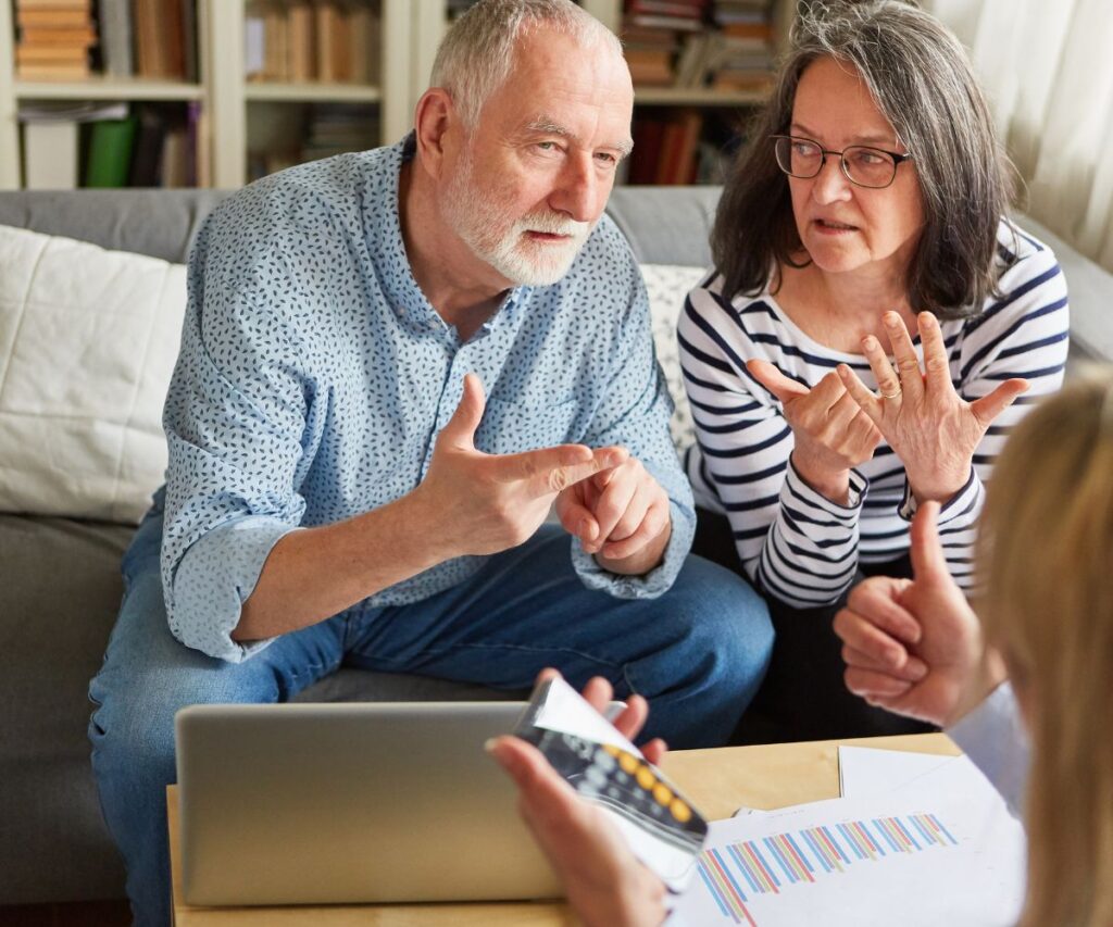 older couple discussing their retirement finances with a financial planner