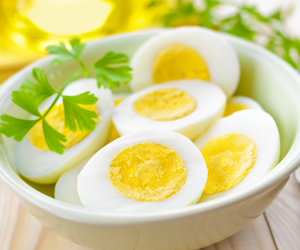 A bowl of hard boiled eggs cut in half